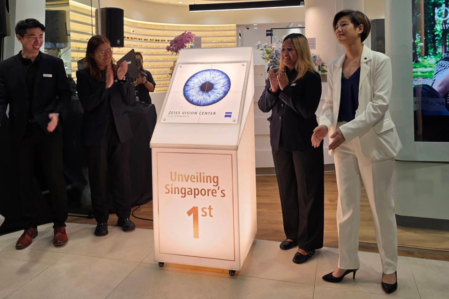 Unveiling of the first Zeiss Vision Center in Singapore. Five people in the image are applauding the ceremony.