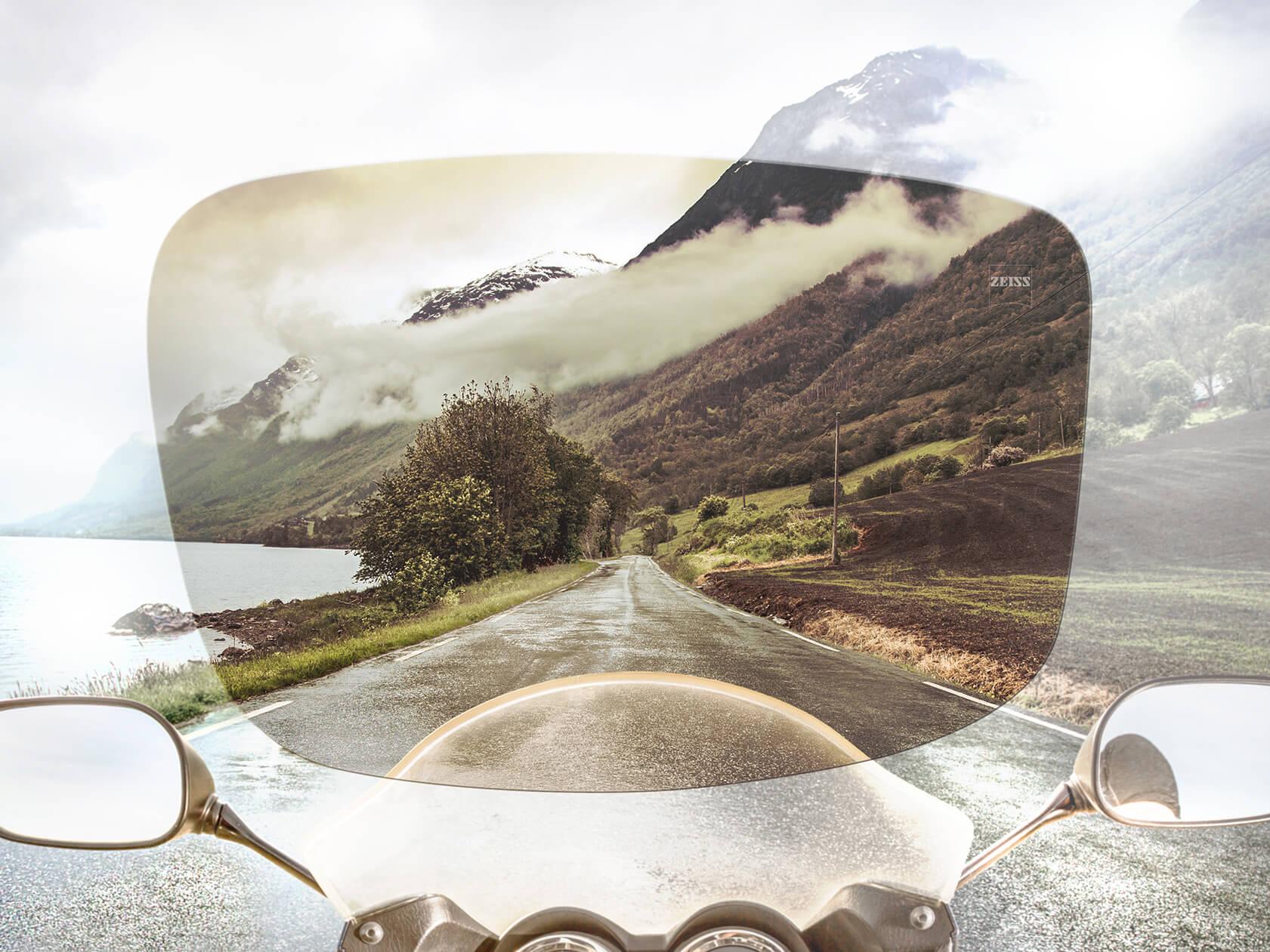 View from the driver's perspective of street and landscape through ZEISS Skylet sunglasses lenses 