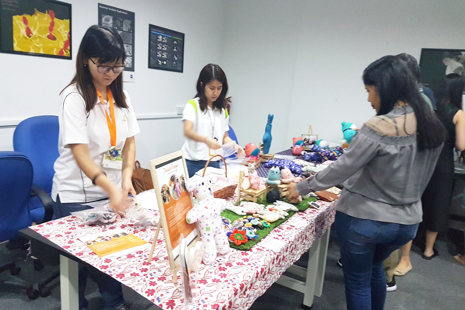 Fei Yue personnel prepared a kiosk showcasing goods such as cushions, pouches.