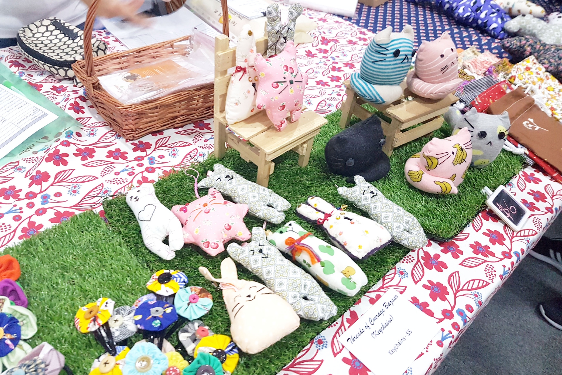 Image of the handmade stuffed animals on the kiosk table.