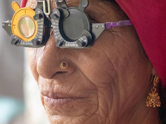 Older woman wearing refraction glasses.