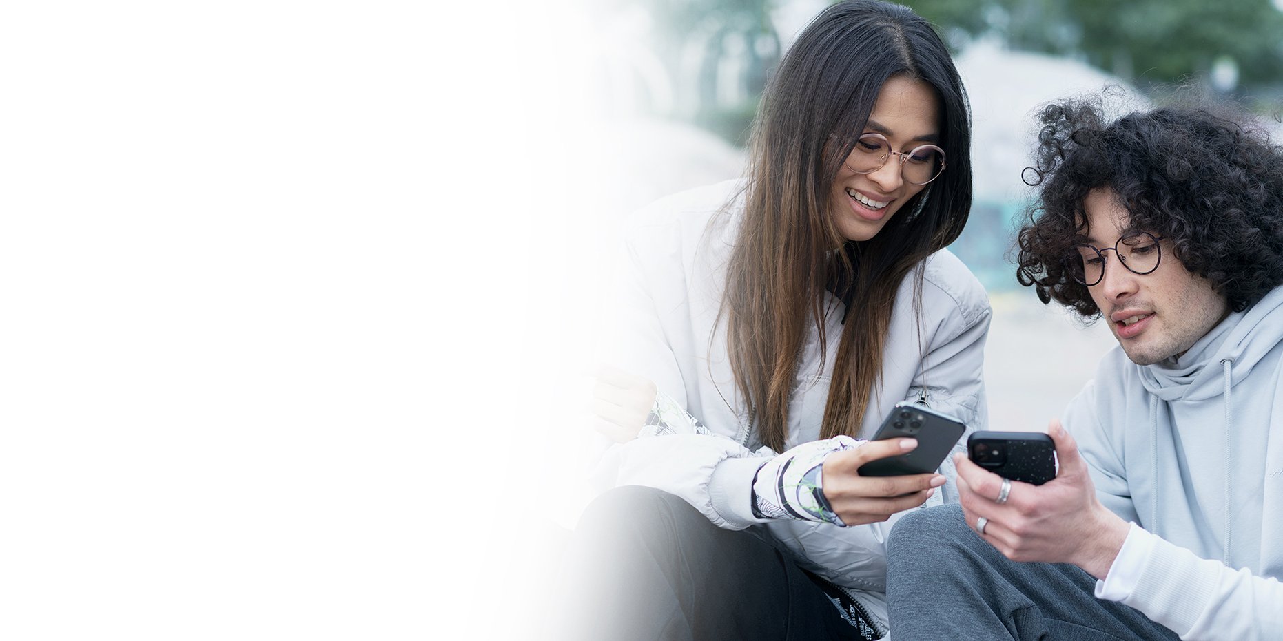 Two young people looking at phone